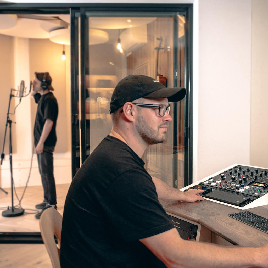 Engineer tracking vocals with the Audient Horizon 8P in a recording studio