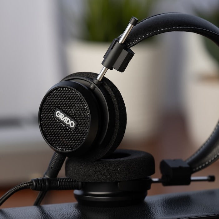 Grado Signature S150 headphones on a desk, close-up of the open-back grille