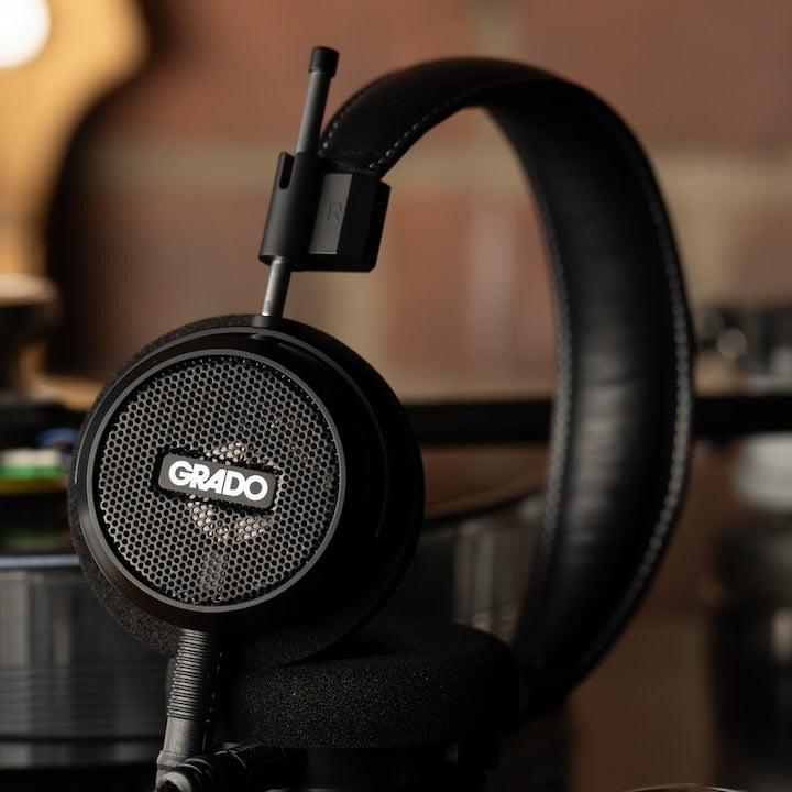 Grado Signature S150 headphones next to a turntable