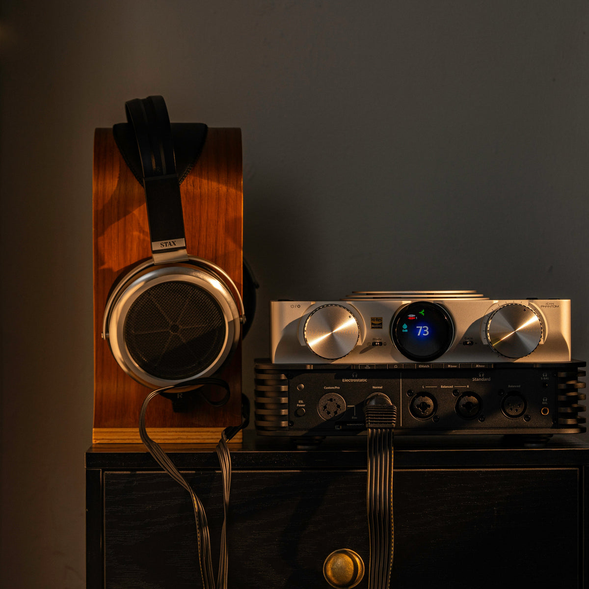 iFi Audio iCAN Phantom 1.5 on a cabinet driving STAX electrostatic headphones