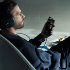 Sony NW-WM1AM3 Walkman, listening with headphones in a lounge chair
